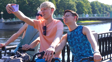 Boys are enjoying a little walk by the river